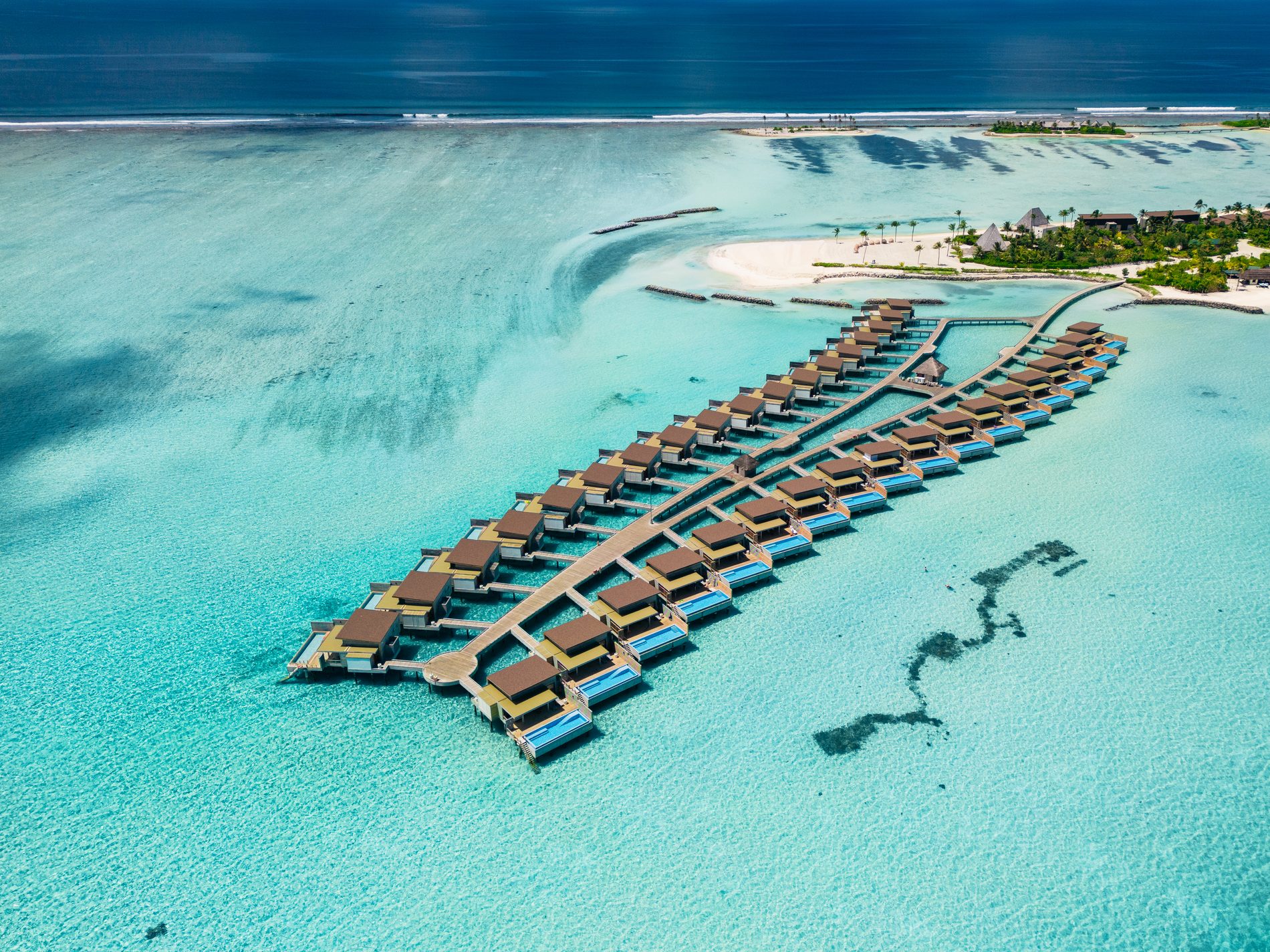 Water villas at sunset from above, Kuda Villingili