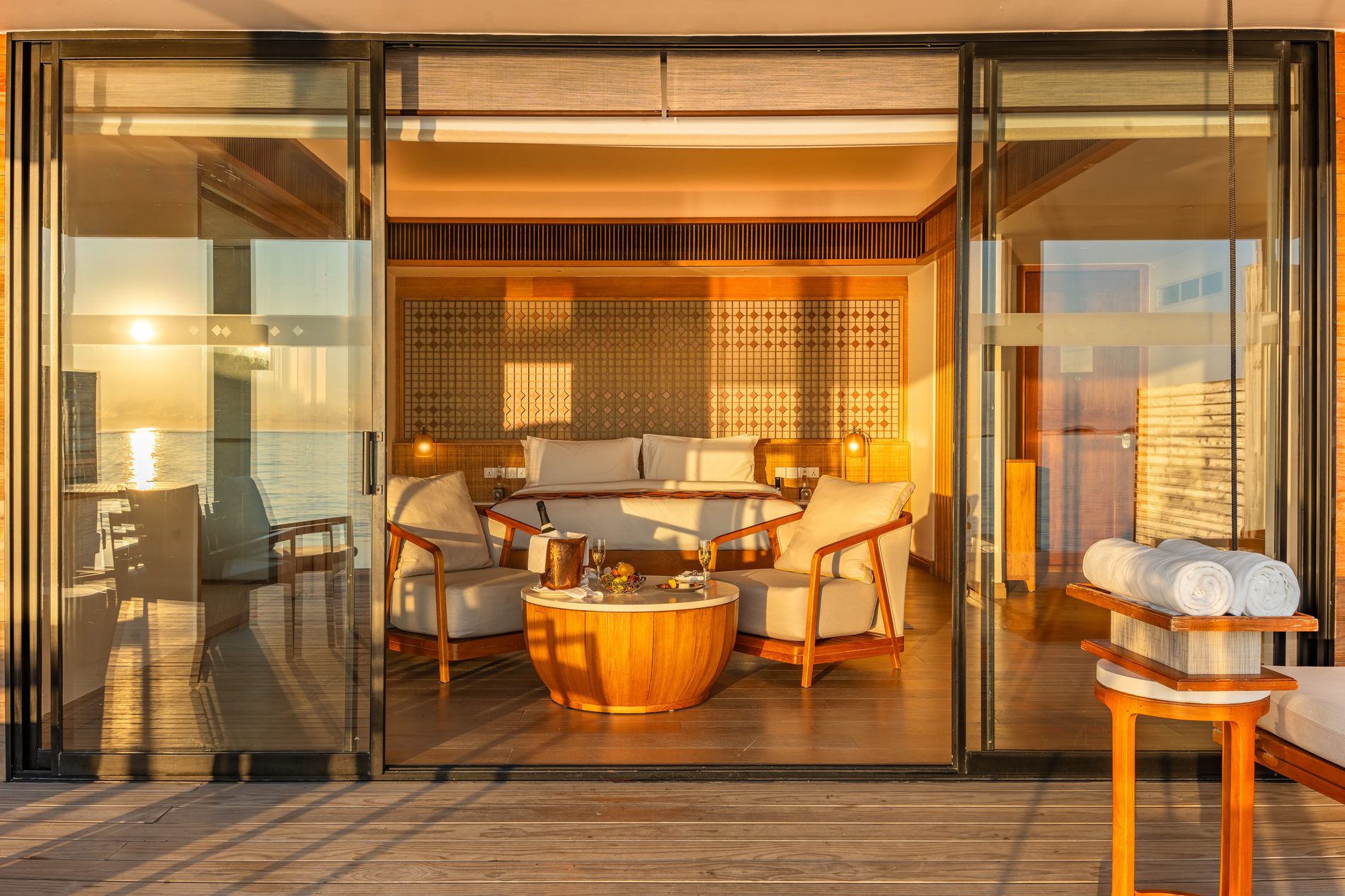 Water villa interior at golden hour, Kuda Villingili